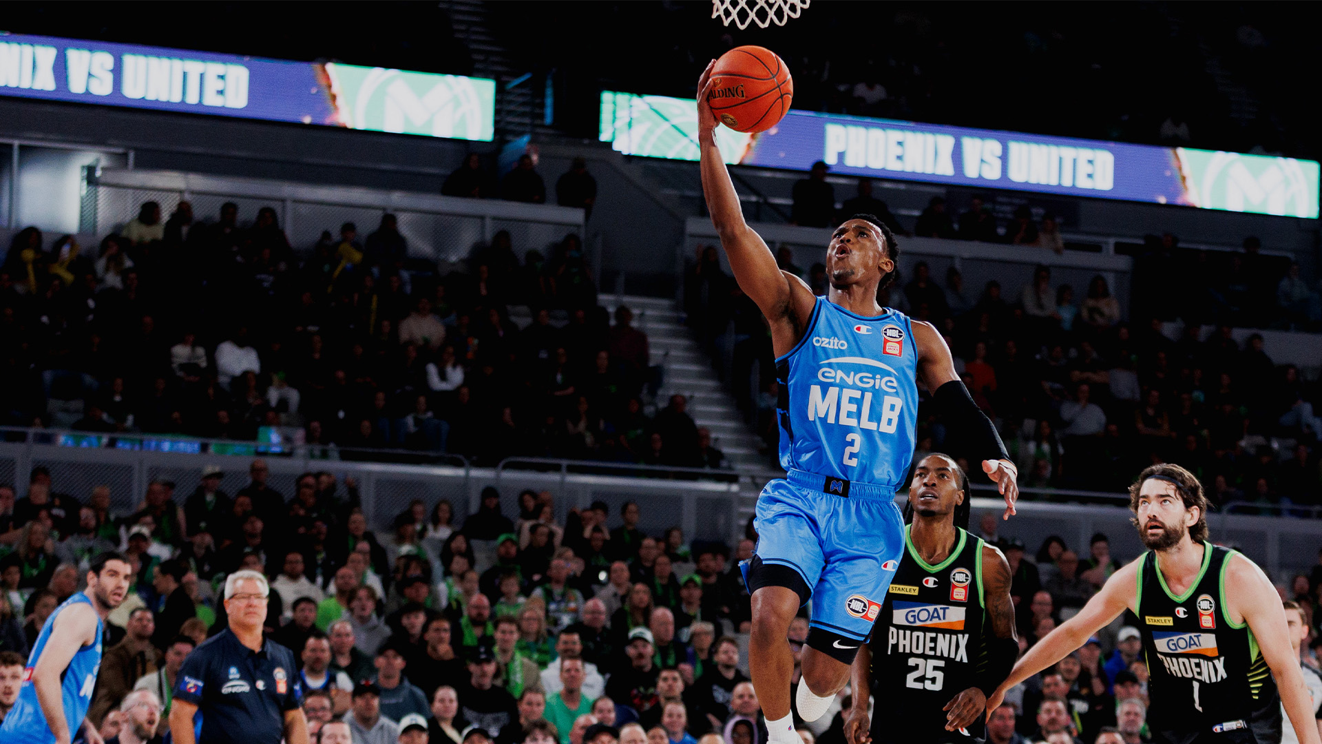 Melbourne United basketball performing a dunk.