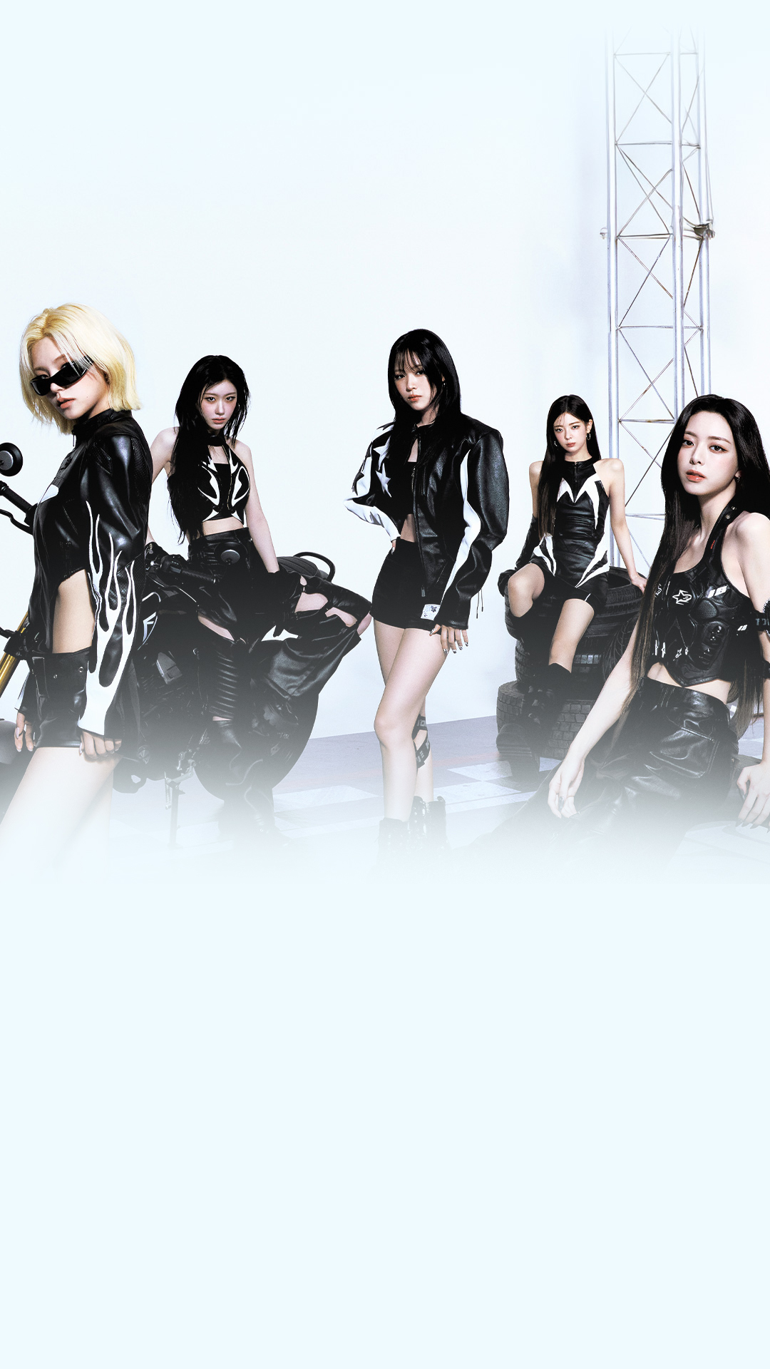 ITZY band members dressed in black and posing as a group.